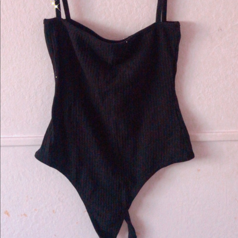 Black and white bodysuits with straps